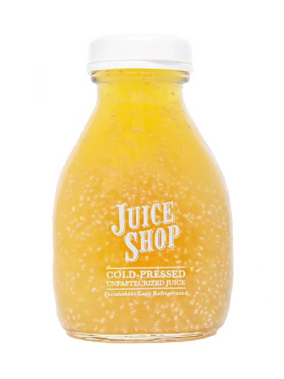 Juice Shop cold-pressed unpasteurized juice in a glass bottle with a white cap. Vibrant golden color with visible chia seeds suspended in liquid. Organic, perishable, and must be kept refrigerated.