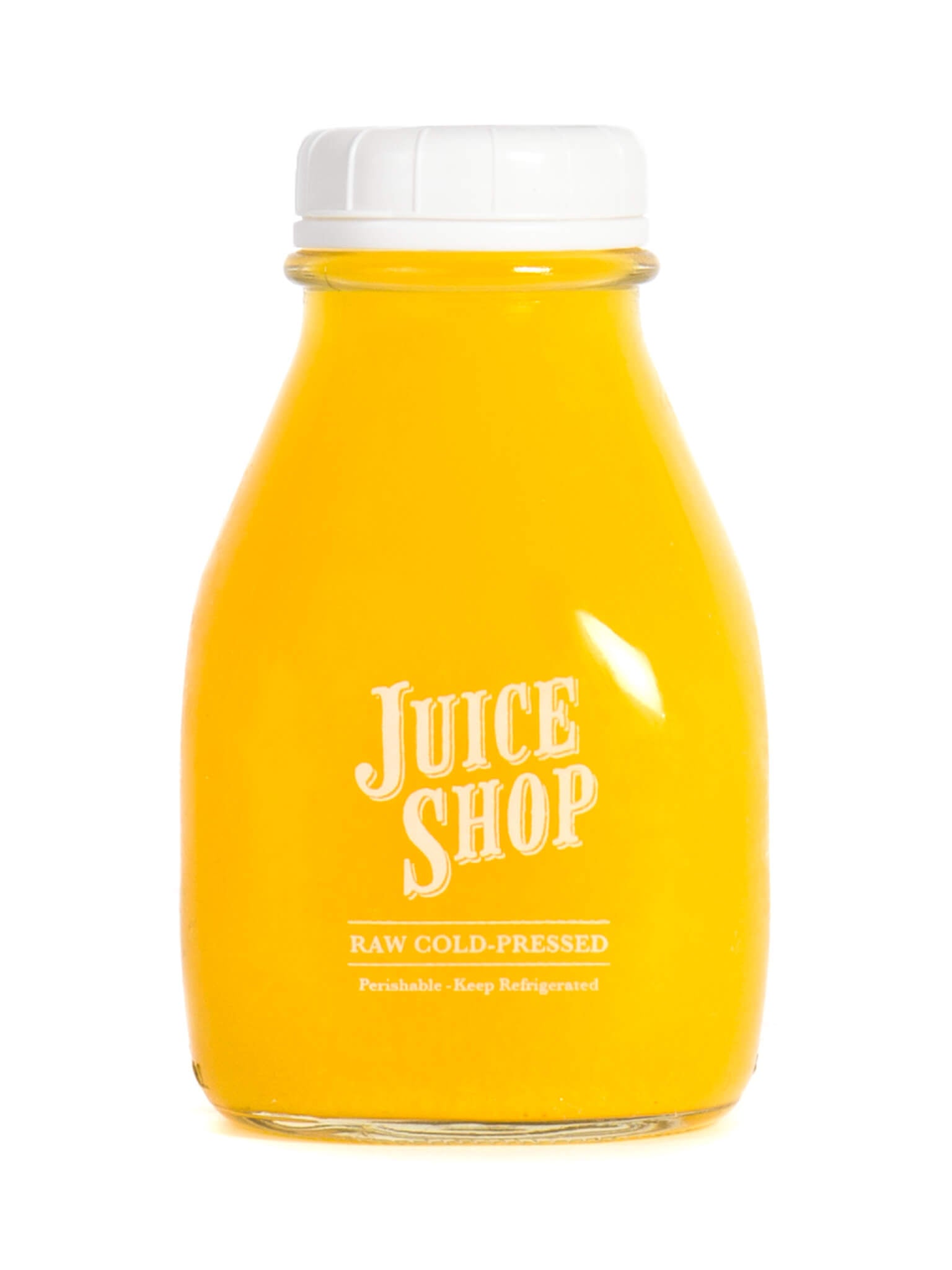 Juice Shop raw cold-pressed yellow juice in a glass bottle with a white cap.